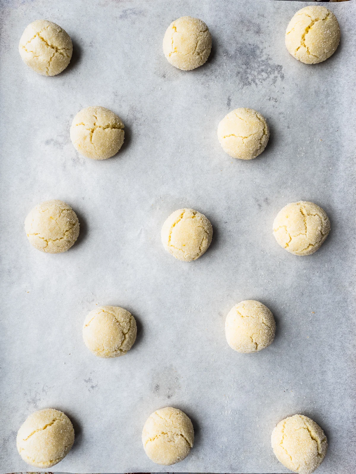 Baked amaretti cookies on sheet pan.