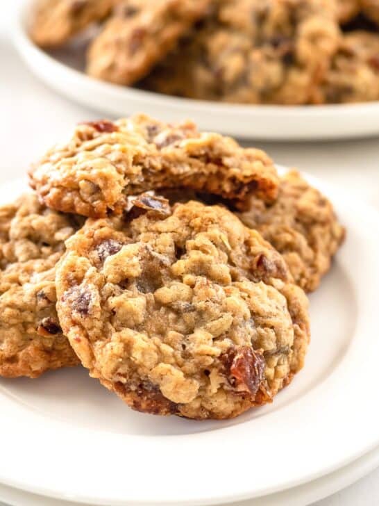 Oatmeal date cookies on white dish.