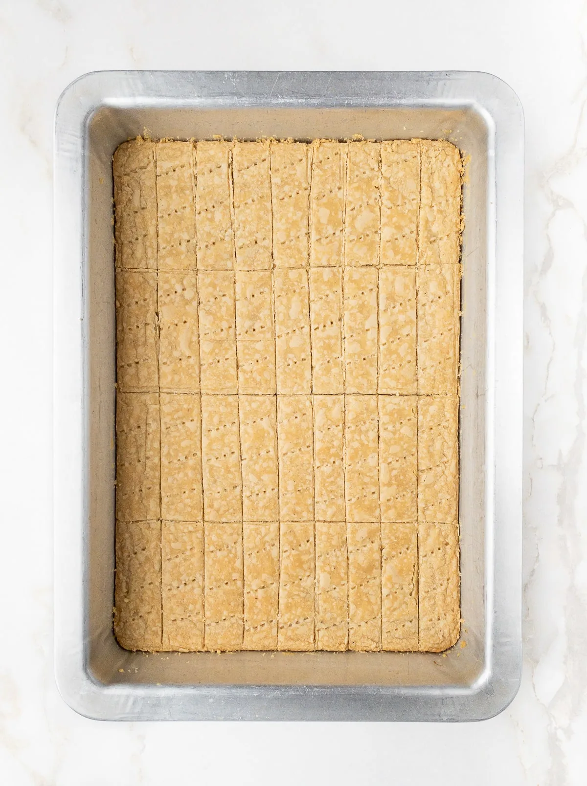 Baked tray of cardamom shortbread.