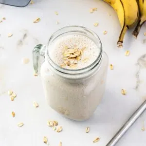 Banana oat smoothie in mason jar.