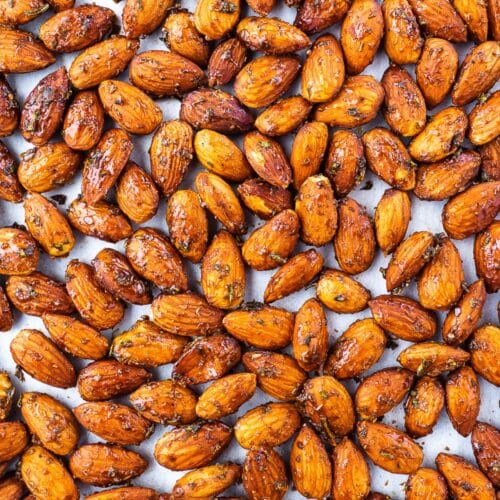 Roasted rosemary almonds on baking sheet.