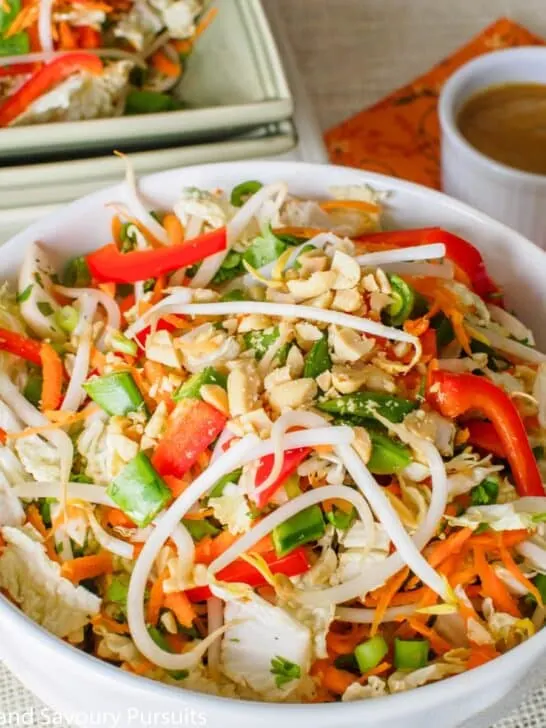 Large bowl of Asian style salad with peanut dressing.