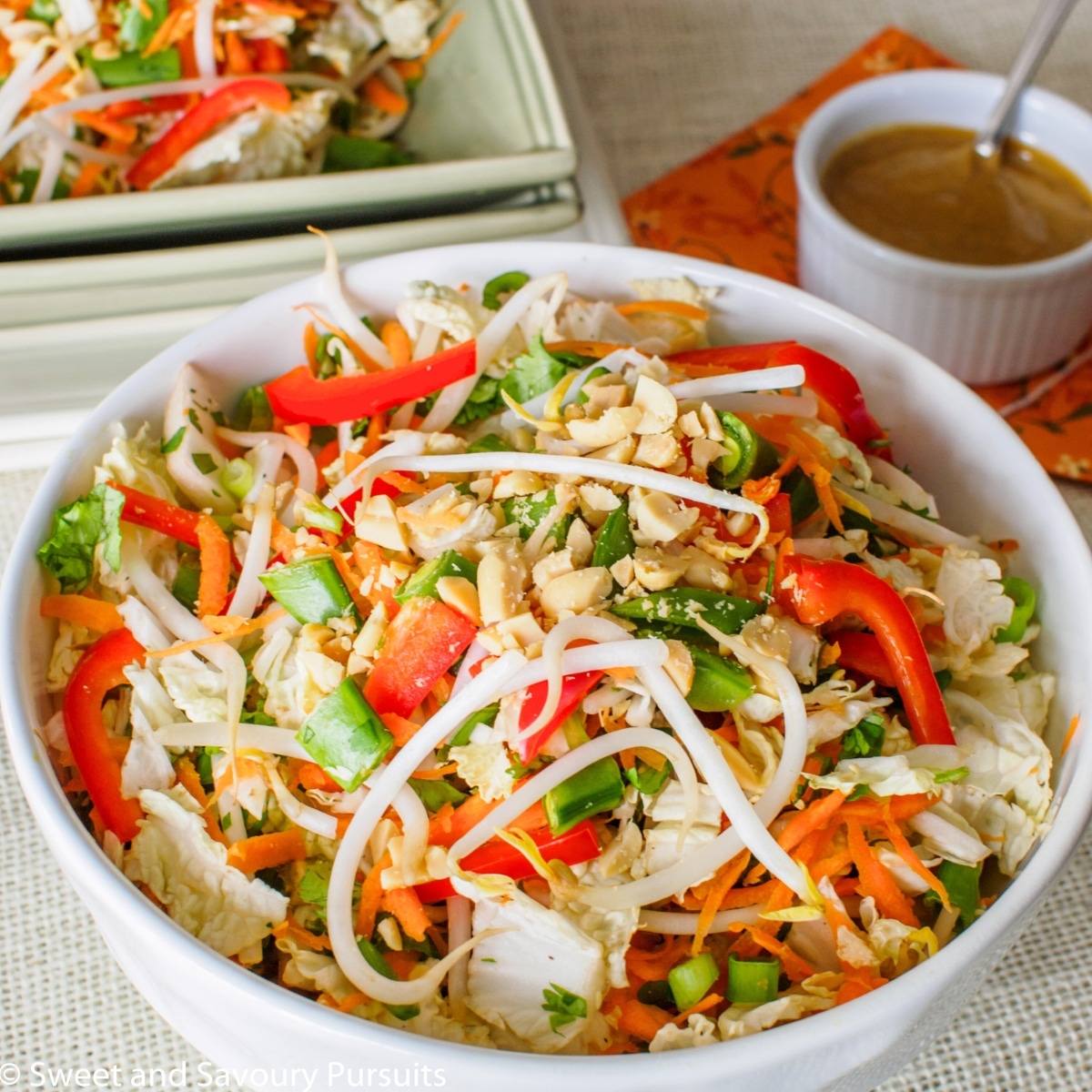 Large bowl of Asian style salad with peanut dressing.