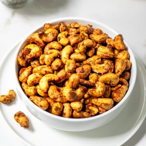 Bowl of roasted curried cashews.
