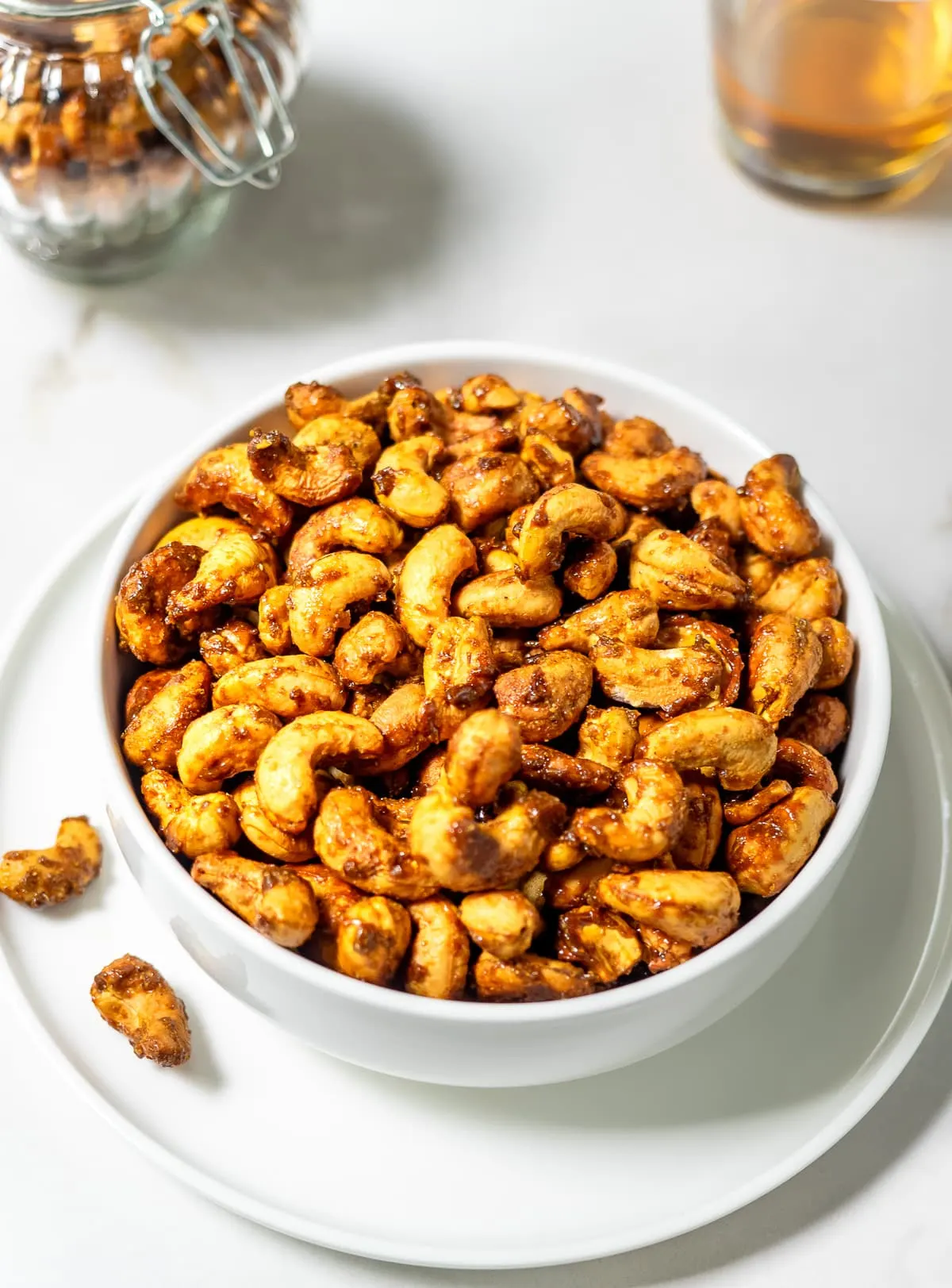 Bowl filled with roasted curry cashews.
