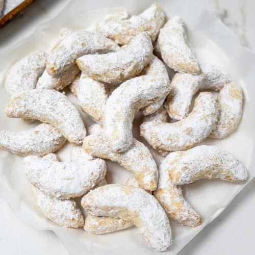 Dish of crescent shaped ground nut cookies.