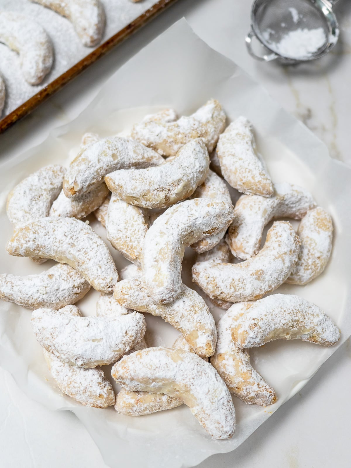 Crescent cookies on large dish.