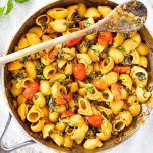Pasta dish with spinach in a creamy tomato sauce.