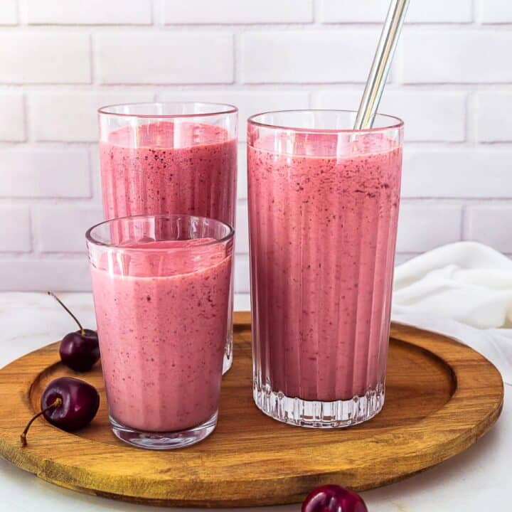 Three glasses of cherry smoothie.