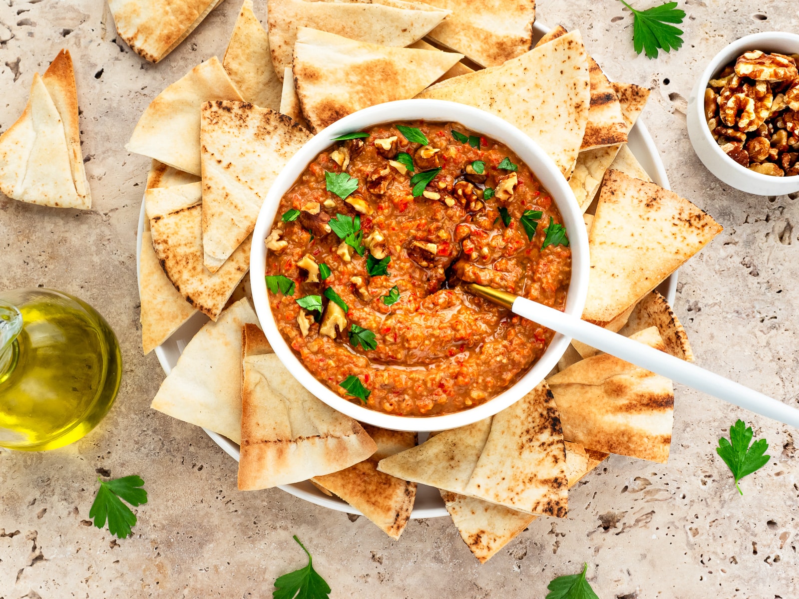 Bowl of M'hammara served with Pita chips.