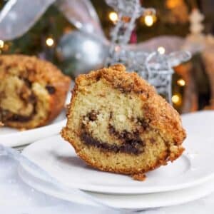 Slice of chocolate cinnamon bundt cake on small dish.