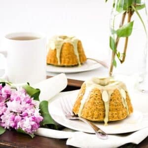 Two plated mini almond and matcha bundt cakes.