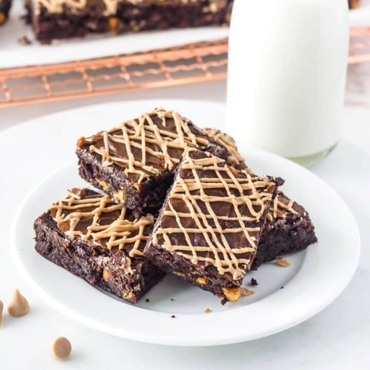 Salted caramel chip brownies on small plate.