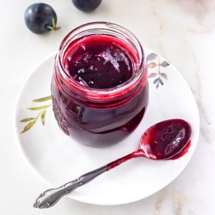 Small jar of plum jam.