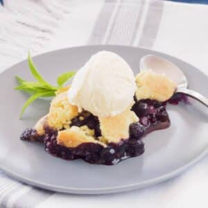 Serving of Blueberry Lemon Cobbler on plate.