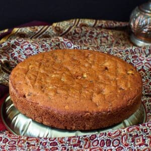 Date and walnut cake on dish.