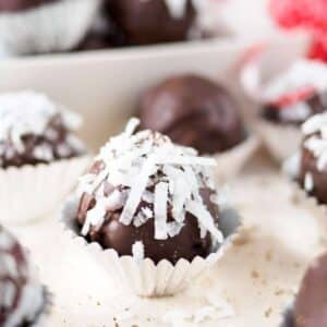Chocolate coconut and almond truffles on board.