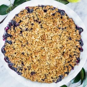 Top view of a pear and blueberry crumble.