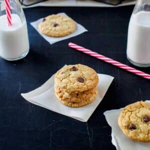 Quinoa chocolate chip cookies on dark board.